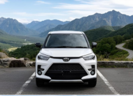 White Toyota Raize 2022 compact SUV parked on mountain road