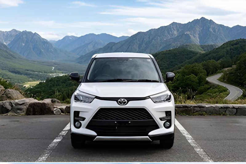 White Toyota Raize 2022 compact SUV parked on mountain road