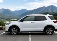 White Toyota Raize 2022 compact SUV parked on mountain road