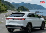 2023 Honda Vezel hybrid SUV in white on scenic road