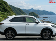 2023 Honda Vezel hybrid SUV in white on scenic road