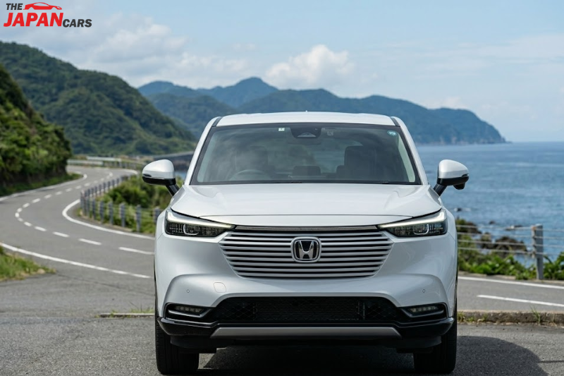 2023 Honda Vezel hybrid SUV in white on scenic road