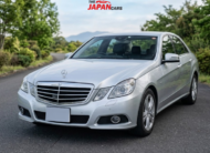Mercedes-Benz E300 2012 silver luxury sedan with 3.0L engine parked on road