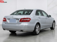 Mercedes-Benz E300 2012 silver luxury sedan with 3.0L engine parked on road