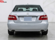 Mercedes-Benz E300 2012 silver luxury sedan with 3.0L engine parked on road