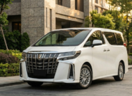 2023 Toyota Alphard luxury minivan in white parked in modern city