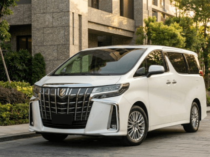 2023 Toyota Alphard luxury minivan in white parked in modern city