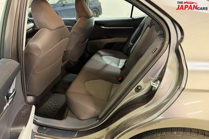2021 Toyota Camry sedan in metallic brown front side view
