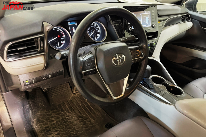 2021 Toyota Camry sedan in metallic brown front side view