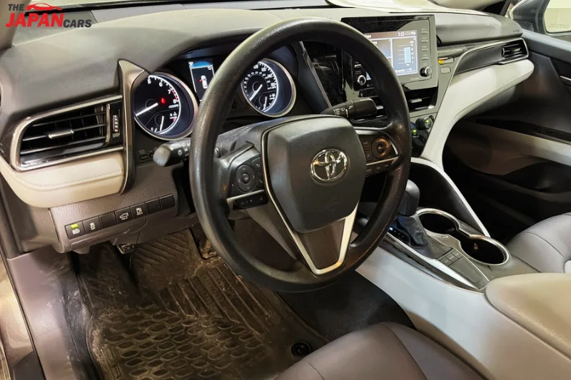 2021 Toyota Camry sedan in metallic brown front side view